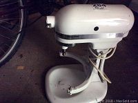White KitchenAid Heavy Duty stand mixer body showing model and wear