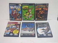 Group shot of all six PlayStation 2 game cases