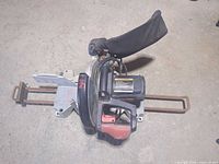 Top view showing full Craftsman compound miter saw with dust bag and slide rails