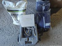 Bag of GreenGrit abrasive, pneumatic air blaster with hose and case, three sealed coverall packs