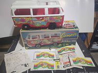 Overall lot with VW camper toy on box, instruction sheet and decal sheets