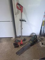Leaf blower, string trimmer, batteries, charger, toolkit grouped