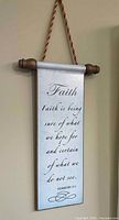 Full view of wall scroll showing design, text, hanger and finials