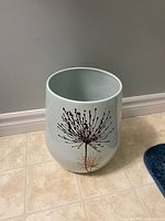 Porcelain wastebasket showing exterior color and motif