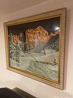 Front view of framed alpine winter landscape print