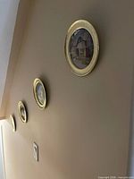 Four plates mounted on wall in descending line