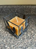 Square metal and glass candle holder with included pillar candle