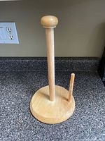 wooden paper towel holder on countertop