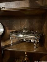 Warming tray on shelf with lid attached