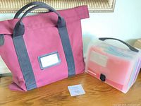Burgundy tote and translucent accordion file side by side