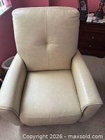 Full front view of beige leather chair