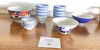 Assorted porcelain bowls arranged on table