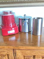 Red Cuisinart ice cream maker base, stainless steel canister with lid, additional stainless insert