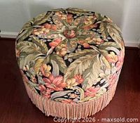 Top view showing floral upholstery and button-tuft detail