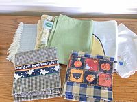 Group shot of all six cloth napkins spread on table