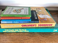 Stack of six books showing titles and formats