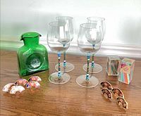 All items: four wine glasses, green vase, six napkin rings, two boxes cocktail picks