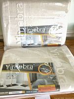 Two sealed packages of Yimobra beige bath mats