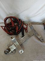 Draw-Tite bumper-mount trailer hitch with tow ball and booster cables on tabletop