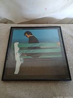 Front view of framed Silk Degrees album with visible blue signature