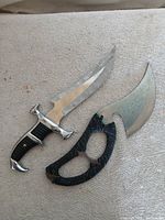 Both knives side by side on neutral background
