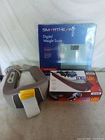 Both boxed items: SmartHeart scale, Wahl massager