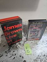 Lot overview showing both tapes standing on countertop