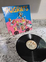 Front cover of Rugrats "Rugrat Rock" LP with record displayed