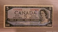 Obverse of 1954 Bank of Canada $5 bill showing serial number 2179494 and portrait of Queen Elizabeth II