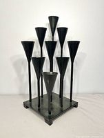 front view showing nine cones and square base