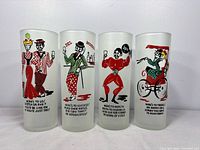 Front view of all four frosted tumblers showing graphics