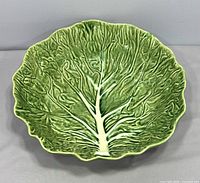 Top view of green cabbage leaf bowl showing full design and size