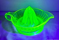 juicer glowing bright green under UV light