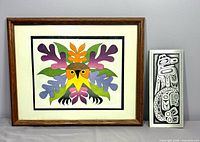 Framed Summer Owl lithograph beside aluminum Thunderbird plaque