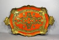 Full view of gilt and orange Florentine tray front