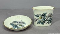 Toothpick holder and dish side by side to show matching pattern and scale
