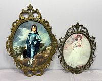 Both oval brass framed prints side by side