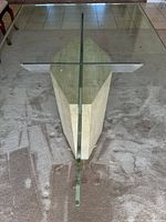 Top view showing glass tabletop and marble pedestal base