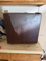 Side view of compact refrigerator showing wood-grain exterior