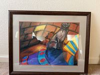 Full view of framed artwork showing subject, matting and frame