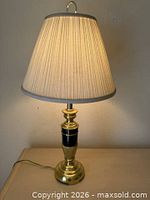 Lamp lit with shade attached showing overall appearance