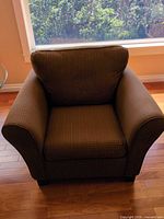 Front view of brown patterned armchair