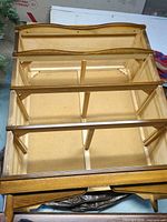 Top view of dresser frame without drawers showing four drawer bays