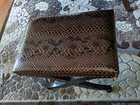 Top view of faux snakeskin upholstered bench