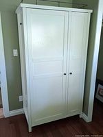 Front view of white Shaker two-door wardrobe armoire closed