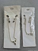 Both sealed jewelry sets side by side on display cards