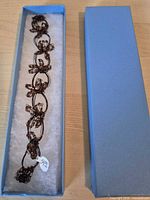 Bracelet in open blue box showing full length
