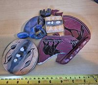 Front view of assorted broken soapstone pieces