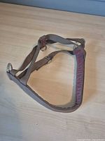 Full view of brown nylon large dog harness on tabletop