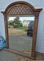 front view showing full mirror and wood frame